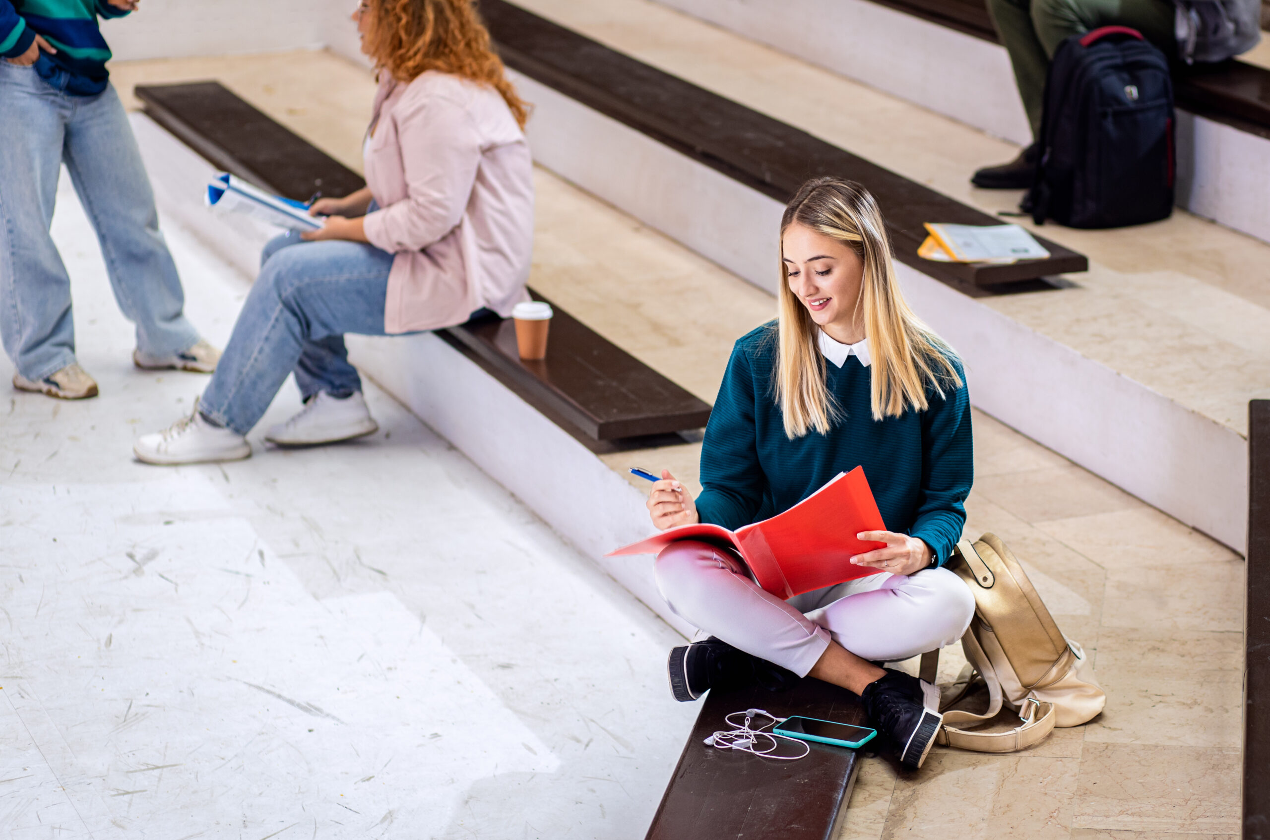 Portrait of female student siting in campus learning.